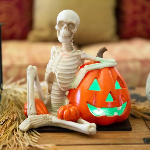 Flora Bunda 9 in. x 7 in. Halloween Lighted Polyresin Skeleton and Orange Pumpkin with Color Changing LED Lights